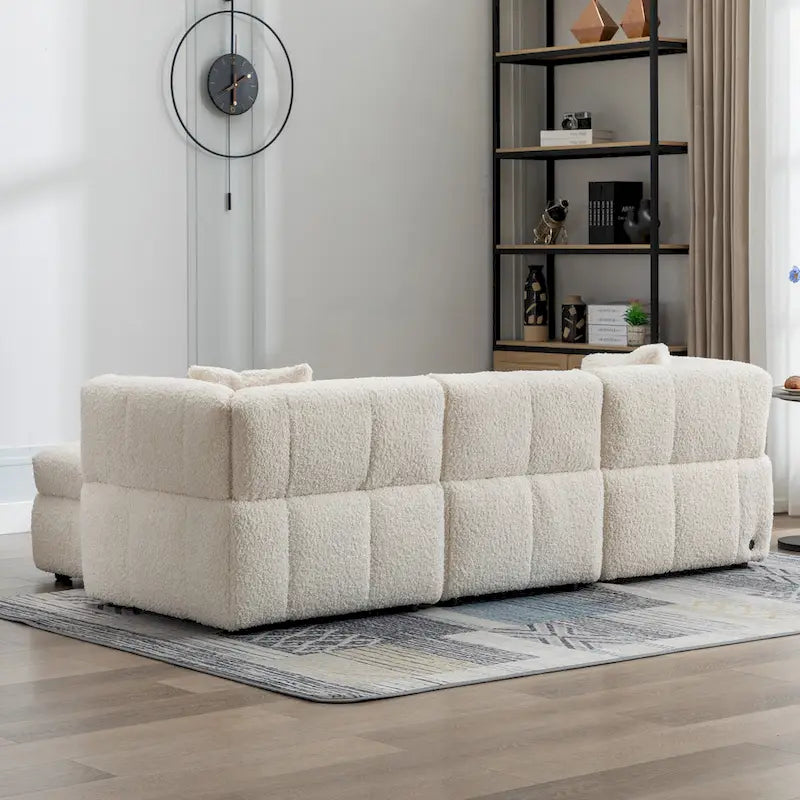 Divano sezionale Roomfitters Cozy in tessuto pile Teddy con porte USB, pouf contenitore mobile e due cuscini lombari