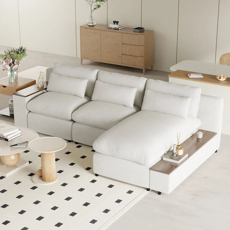 Divano componibile a L beige con cuscini dello schienale rimovibili, 3 cuscini decorativi e vani portaoggetti